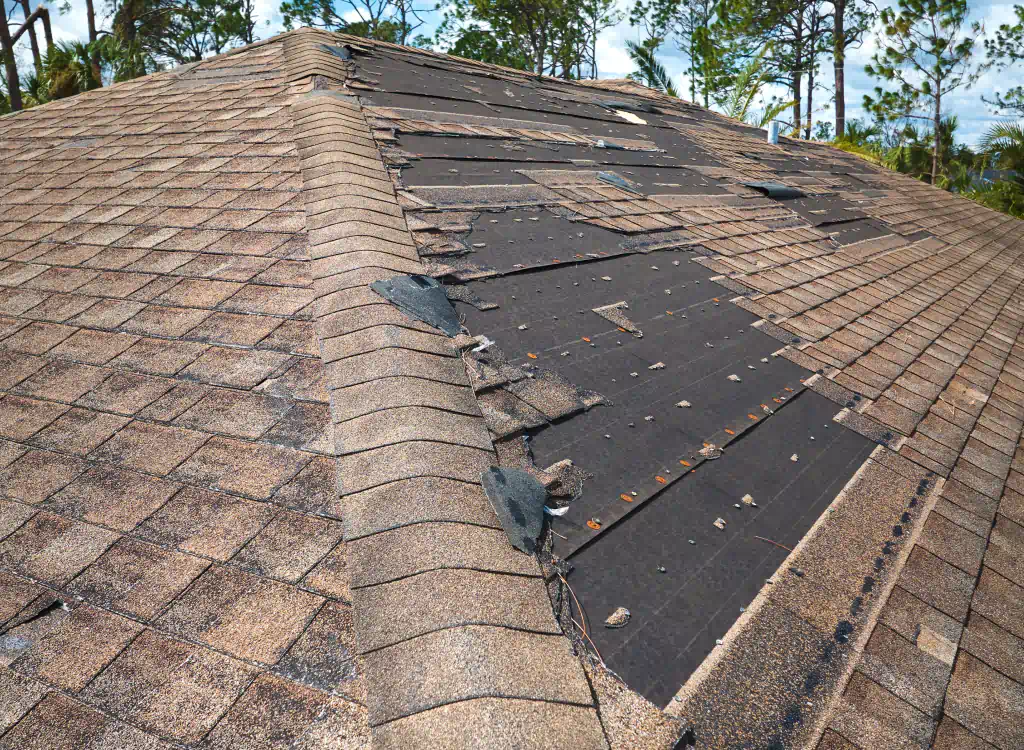 damaged roof in a house after a storm